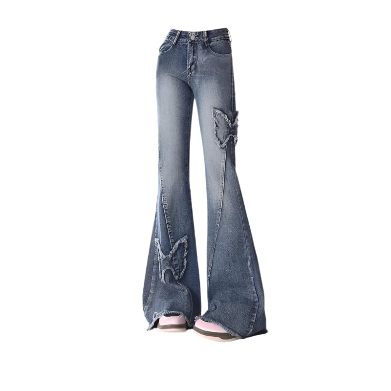 Blue jeans with butterfly patches on a white background