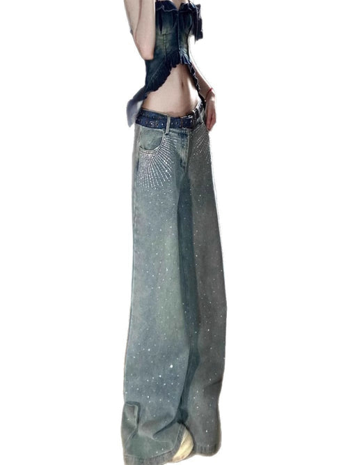 Long denim jeans with rhinestone accents on a white background