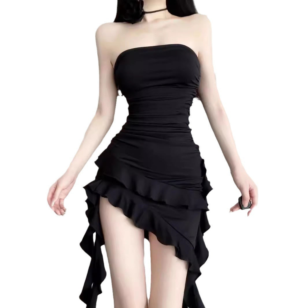 Black strapless dress with ruffled skirt on a white background